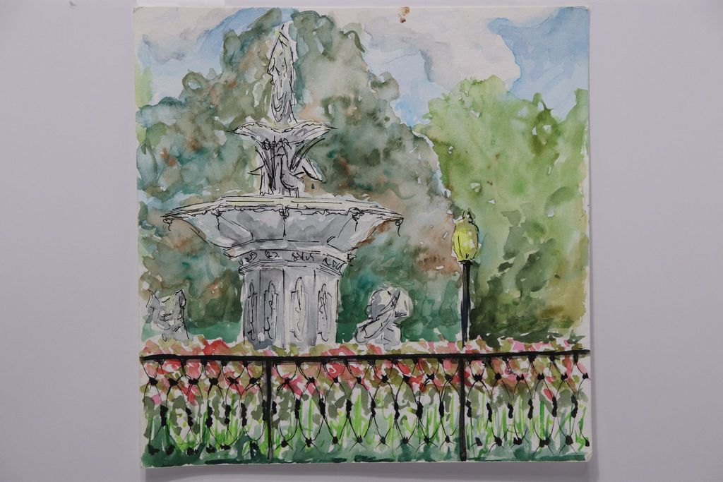 A photograph of the Forsyth Park fountain, an example of the original art placed in clients' homes.